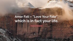 A qoute "love your fate" with a scenic mountainous background- clouds and ice sourounding the mountain top.